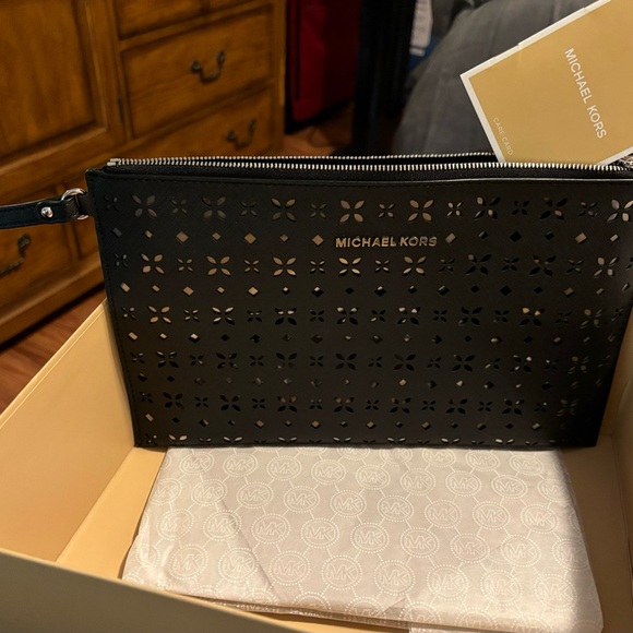 Michael Kors Women’s Floral Perforated Large Zip Clutch - Picture 2 of 13
